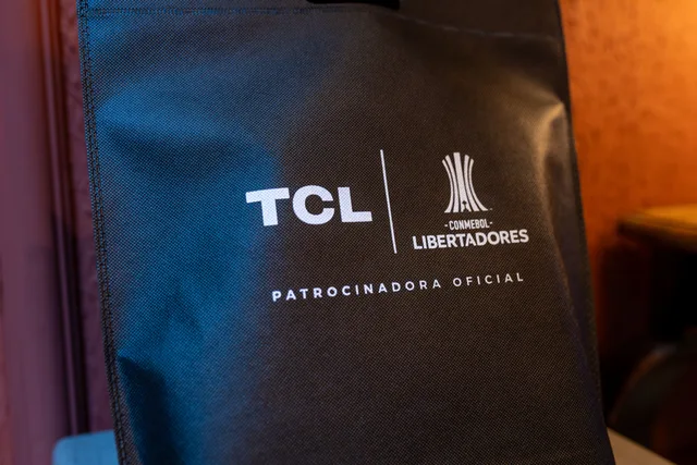 Close-up of a black sponsorship bag showing TCL and CONMEBOL Libertadores logos with brand details. Sponsorship rights versus ordinary advertising inventory